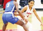 Ladycats ride swarming defense to tourney title