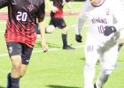 RIGHT: Mexia’s Fernando Navarro (20) dribbles against an Athens player during a match at Blackcat Stadium on Friday night. Navarro made history as the first freshman to score a hat trick in Mexia High School history. His three second-half goals helped t