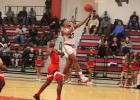 Mexia's Jalen Busby scores two of his 21 points in a win over Rusk on Tuesday night.